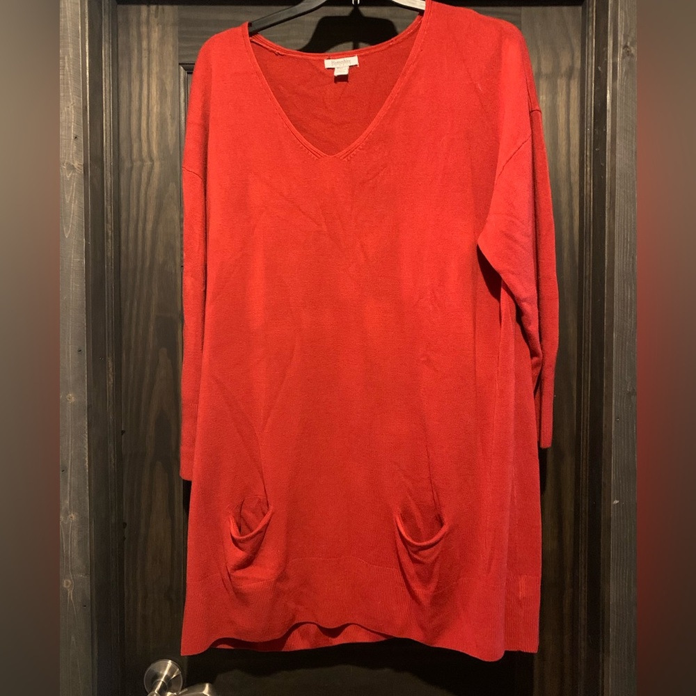 Red tunic length sweater with pockets.